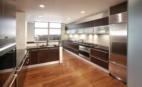Cabinetry laid out in long, horizontal bands directs attention toward views of downtown Milwaukee and Lake Michigan.