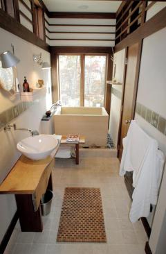 Rhythmic millwork ties together a band of clerestory windows that run throughout the house. The windows bring in natural light from every direction and share that light with the home's interior rooms.