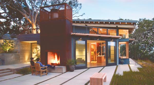 The plan of this sod-roofed house dodges the mature oaks that dot its site.