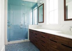 To keep things simple, the architect designed cutouts instead of knobs for the cabinet pulls.