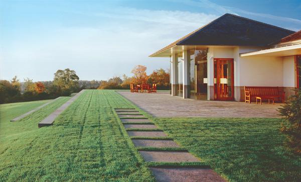 Simple building forms and a strictly ordered geometry heighten the drama of this guesthouse's hilltop site.