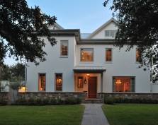 Shaker Lodge is a new house in an old neighborhood. The home is a blend of Shaker-style interior detail and a great room takes inspiration from the great lodges of America's National Parks.