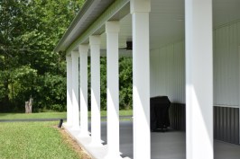 The finished product: Snap-Tite™ PVC column wraps on an outbuilding