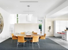 Dining area with stair beyond and kitchen