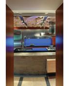 This+clean%2c+contemporary+kitchen+in+Omaha+features+a+mix+of+materials%2c+including+stainless+steel%2c+cast+concrete%2c+cherry%2c+bubinga%2c+and+maple.