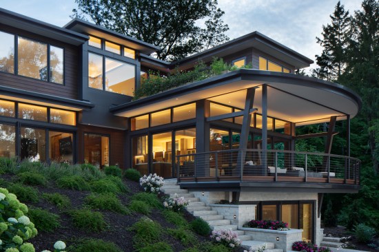 The Stepping House: the deck’s form is inspired as a ship’s bow stretching from the hillside and reaching to the water.