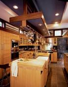 A capacious custom pot rack hangs above the kitchen island for easy access and direct task lighting.