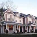 Varied gables and porch treatments give the Woodridge and River Bridge townhomes a bit of distinction.