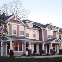 Varied gables and porch treatments give the Woodridge and River Bridge townhomes a bit of distinction.