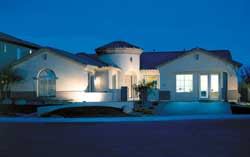 Architectural features such as rotundas and rounded edges are hallmarks of the Starlight model at Anthem Parkside in Phoenix. The master suite is split from the other bedrooms, which are clustered around a wall-hugging tech center. The split garages create a natural courtyard at the entry.