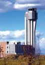 A transmitter from Proxim Corp. at the visitor's center at the Stapleton project in Denver beams up to the control tower at the old Stapleton Airport. This technology is part of the infrastructure that will help build a wireless community for 12,000 to 15,000 homes on 7.5 square miles.