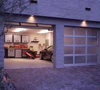 The use of dual garage doors and translucent panels reduces the mass of the two-car garage on the elevation.