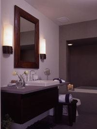 The mirror-image, lower-level suites offer the owners myriad possibilities, from guest bedrooms to a game room, home office, yoga room/gym, or art studio. Each suite provides access to a generous walk-out patio and the waterfront.