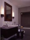 The mirror-image, lower-level suites offer the owners myriad possibilities, from guest bedrooms to a game room, home office, yoga room/gym, or art studio. Each suite provides access to a generous walk-out patio and the waterfront.
