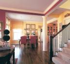 Nine-foot ceilings on the main level make a house feel larger, even when the lot size requires shrinking the footprint. Varied ceiling heights add to the sense of openness.