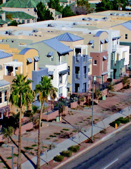 MIX AND MATCH: Artisan Homes used a medley of soft colors, roof forms, and shade elements, from awnings to pergolas, to create a lively Phoenix streetscape.