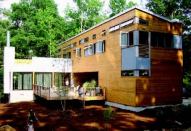 CLEAN LINES: The natural exterior materials used on many prefab modernistic projects like this “Camp Smull” house by Resolution: 4 Architecture of New York lends a warmer feel to the minimalist forms.