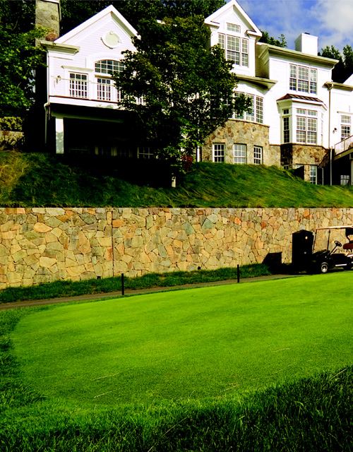 FINE FORM: For developer Donald Trump, shown here teeing off on his beloved Trump National Golf Club course, it was important that the 16 golf villas look great from both the front and the back. The rear façades of the Carlyle (left) and the Dorchester (right) have even more stone accents, windows, and architectural detail than the front façades.