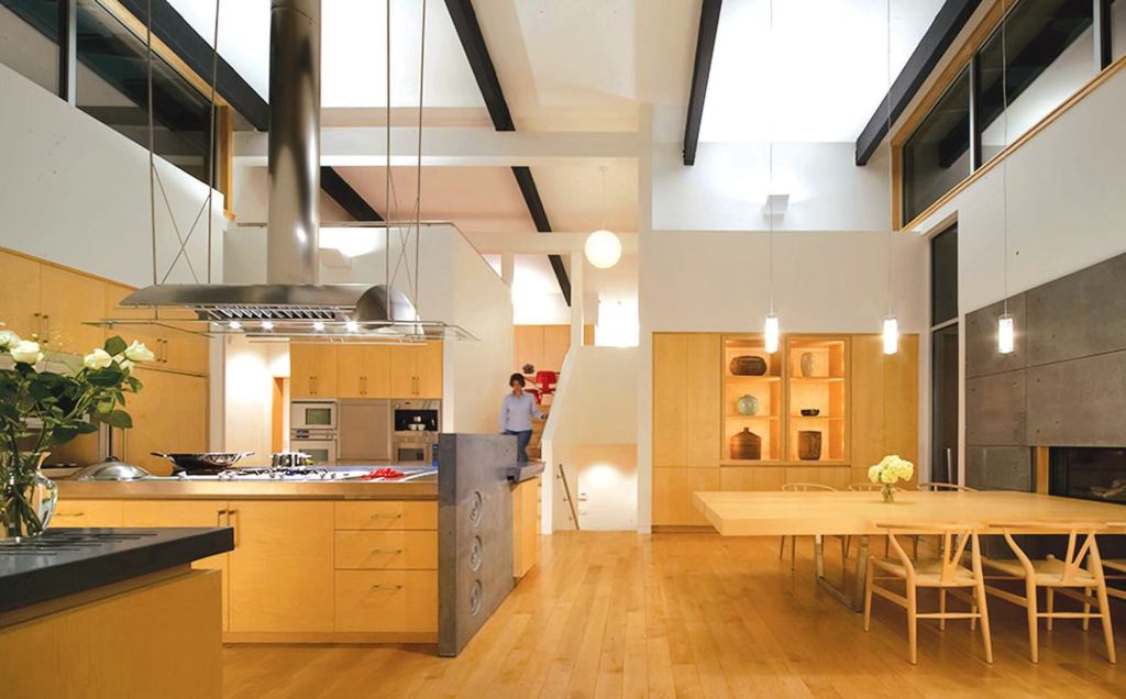 Every element of the kitchen expresses the clients' wish for functionality coupled with modern design. Natural materials help bring cohesiveness to the large and open space.