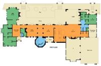 SMART PLAN: The home's decidedly linear, two-story floor plan takes maximum advantage of lake views along the rear of the property. Private spaces are pushed to the ends, such as the master bath and closet on one side and the guest suite and one-car garage (topped by spa room and home theater) on the other, a scheme that not only separates them from daily activity, but also preserves views for those spaces that truly deserve and need them. Notice the garages, too: The four bays are split up and turned away or set back from the front elevation on one end of the lot, thus diminishing their mass and bulk. But they also access the house where you'd want them to, directly into the kitchen and the passage past the elevator and rear stairs ... with a separate door to the motor court, to boot.