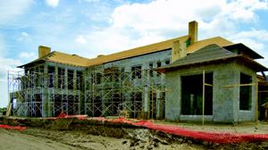 BLOCK STEADY: Most homes in Florida feature a first floor of masonry block, but few carry the material to the top plate of a second floor, much less build a form-and-poured elevated platform (in this case, for the upstairs loggia). The result is a rock-solid structure, built to last as well as mitigate mold and other climate-related hazards that can wither a wood-framed structure.