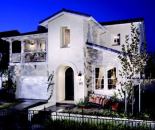 BOX BEAUTIFUL: Small, expensive lots don't always go hand-in-hand with conservative design, as plan 3 at Sarasota (above) in Ladera Ranch, Calif., proved; it was recognized with a merit award in 2000. The architect loosened up the front façade with playful massing and detail to create distinctive forms, most notably a second-floor master-suite balcony over the two-car–garage door, a deeply recessed entry door, and a setback shed roof over the living room.