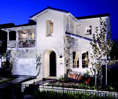 BOX BEAUTIFUL: Small, expensive lots don't always go hand-in-hand with conservative design, as plan 3 at Sarasota (above) in Ladera Ranch, Calif., proved; it was recognized with a merit award in 2000. The architect loosened up the front façade with playful massing and detail to create distinctive forms, most notably a second-floor master-suite balcony over the two-car–garage door, a deeply recessed entry door, and a setback shed roof over the living room.