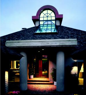 VISION QUEST: Barry Berkus' Style Setter 80s iteration (left), the recipient of a grand award in 1982, featured several new and foreshadowing concepts for residential design: dual master suites on the main level, a wide-open public core, the home as a destination rather than simply shelter. The copper-topped cupola and adjacent skylights on either end flood the interior's center space and a column-supported second-story loft with light and serve as part of a passive solar heating scheme that was way ahead of its time.