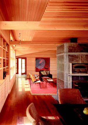 TOASTY AND TASTY: A double-sided wood-burning stove by Tulikivi  heats the whole house. Bonus: The kitchen side of the soapstone chamber incorporates a pizza oven. Electrical-ignition propane heaters provide backup heating in the house, but are seldom used.