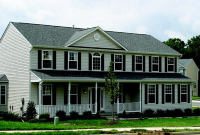 TOP CHOICE: Four elevations are available for the 2,835-square-foot Hawthorn Lux plan. The Virginia colonial model (pictured) features an optional sunroom on the back, a street-friendly front porch, and plenty of windows.