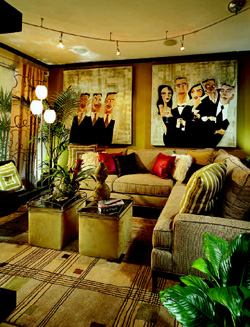 LIVING LARGE: Even a small room can feel sophisticated. Properly scaled furniture, a mix of materials, and artwork that draws the eye upward all help make this living room in Regis Homes' Astor Court model truly livable.