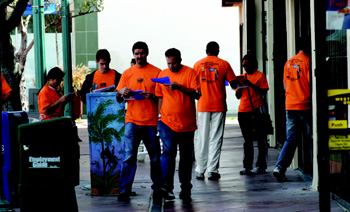 RACE RATS: Clad in bright orange shirts, contestants of La Boheme's Metro Madness scavenger  hunt/race decipher clues to discover and photograph themselves with neighborhood  landmarks, gaining a better sense of what's around the new condo  project.