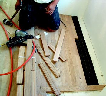 VAPOR RETARDER: A layer of #15 asphalt felt paper between the subfloor and the flooring  helps slow any moisture transfer.