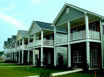 DEVALUED: Because of fraudulent appraisals, these townhouses sold for $210,000, about $60,000 above market value. Now they've been foreclosed on and  are listed for $119,900.