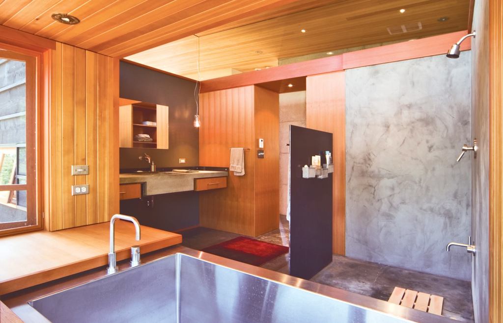 The room’s distinct materials often intersect and overlap without touching. This commendable construction feat imbues hard edges with a fluid quality.