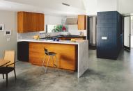 As the cabinets reach floor or ceiling, a recessed reveal sets them apart. Architect Jay Reynolds uses the technique frequently in his work. "It lets two dissimilar materials coexist on their own but work together in a sophisticated composition."