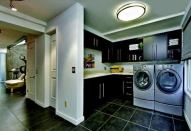 In the back of the plan is a mudroom (above) that enables the occupants to unload groceries brought in from the detached garage, which is separated from the house by a trellised pool area and garden (below), before taking the elevator to the third-level kitchen.