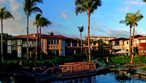 HAWAIIAN PUNCH: The penthouse building at Wailea Beach Villas (above) shows the influence of some of Hawaii's older stucco structures. A kitchen (below) is full of the kinds of luxury materials that affluent retirees demand.