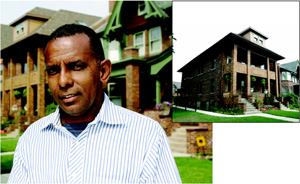 BLOCK AMBASSADOR: Julio Bateau, a Haitian-born Detroit-based builder, stands in front of some  of the homes he has renovated on the street he single-handedly rebuilt and  can honestly call his own.
