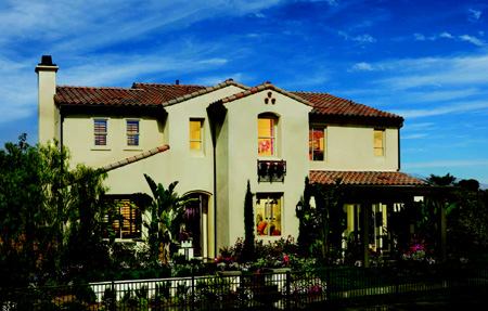 FAMILY-FRIENDLY: The Spanish elevation of the bestselling Plan 2 has everything that families  want, including five bedrooms and a loft, three and a half baths, a two-car  garage plus tandem storage space, and a dramatic vaulted ceiling in the  family room that adds flair to a well-used space.