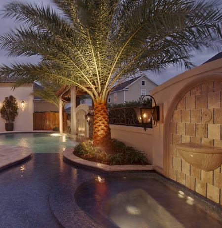 LET THERE BE LIGHT: Landscape lights are triggered at dusk by an astronomical time clock.  Timers can also be set to partially or completely close window blinds during peak sun hours to minmize solar heat gain inside the house.