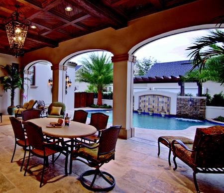 GOOD WOOD: A coffered cypress ceiling lends a touch of class to the back patio.  "Cypress is a natural, high-density hardwood that won't split or shake," says builder Goehring.  In fact, the native species makes multiple appearances throughout the home -- in the soffit overhand and outriggers under the campanile's cap, and in some of the interior trim carpentry.