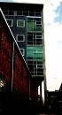 URBAN RENEWAL: Architect Manueal Zeitlin added 32 loft apartments by designing a building that fits over and through and old brick warehouse. A two-story live/work apartment (below) is just one of six plans available at Mercury View Lofts.