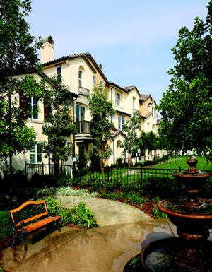 ROOM TO STROLL: A carefully planned site allowed William Lyon Homes to achieve a density of 16 units  per acre at Serafina, yet still provide its buyers with a sense of  openness. Private decks and courtyards overlook pocket parks with benches  and fountains and lush, landscaped paseos.