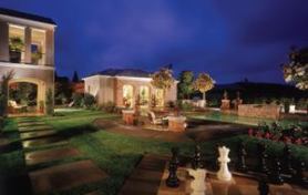 BACKYARD BEAUTY: A rear view of the best-selling Plan 3 shows some of the features that make  it a success: a double loggia, an impressive cabana, and a heavy emphasis  on stone and brick.