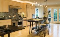 Planks from the same elm tree top off the island and the matching dining table. The long outside edge was left raw for visual and tactile interest.