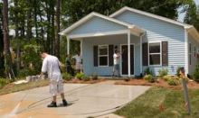 MOVE-IN READY. Building professionals put the finishing touches on one of 263 houses completed this week in Habitat for Humanity’s Home Builders Blitz 2008. Credit: Steffan Hacker, Habitat for Humanity