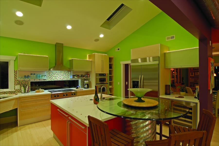COLORFUL KITCHEN: The home’s interior is a mix of bright colors that take advantage of ample natural light and an open floor plan.