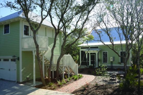 SMALL WONDER: McClellan's house packs a lot of efficiencies into the main home's small footprint (seen in the background), while a detached garage and bonus room above adds relatively cheap usable space.