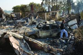 Too hot to handle: Homeowner Jay Gray surveys the destruction to his Rancho Bernardo, Calif., home after fires swept through his neighborhood in October 2007. Few local production builders have had much success participating in the rebuilding efforts.